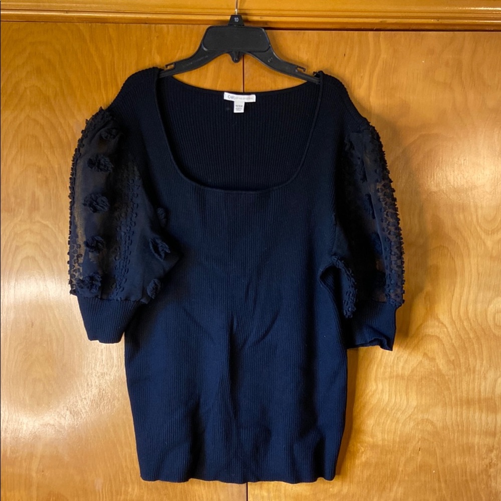 Elegant Black Knit Top with Textured Sleeves. Size 14/16W